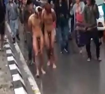 Women being punished naked in front of crowd