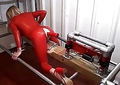 Blonde bdsm slave red latex suit fucked